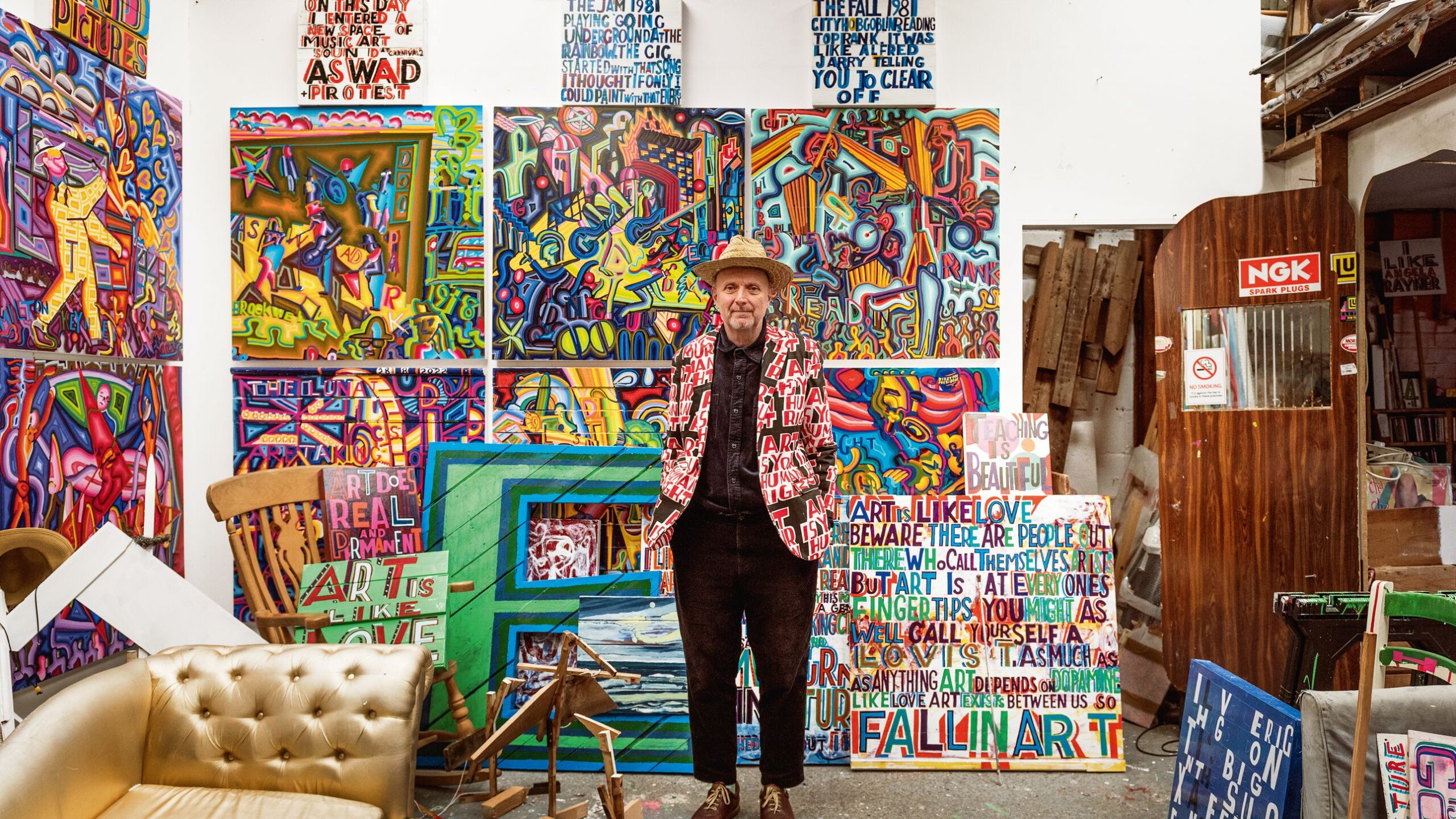 Artist Bob and Roberta Smith opens the door of his colourful studio