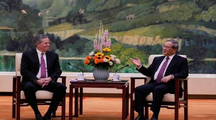 Chinese premier calls for 'dialogue' as US senator visits Beijing