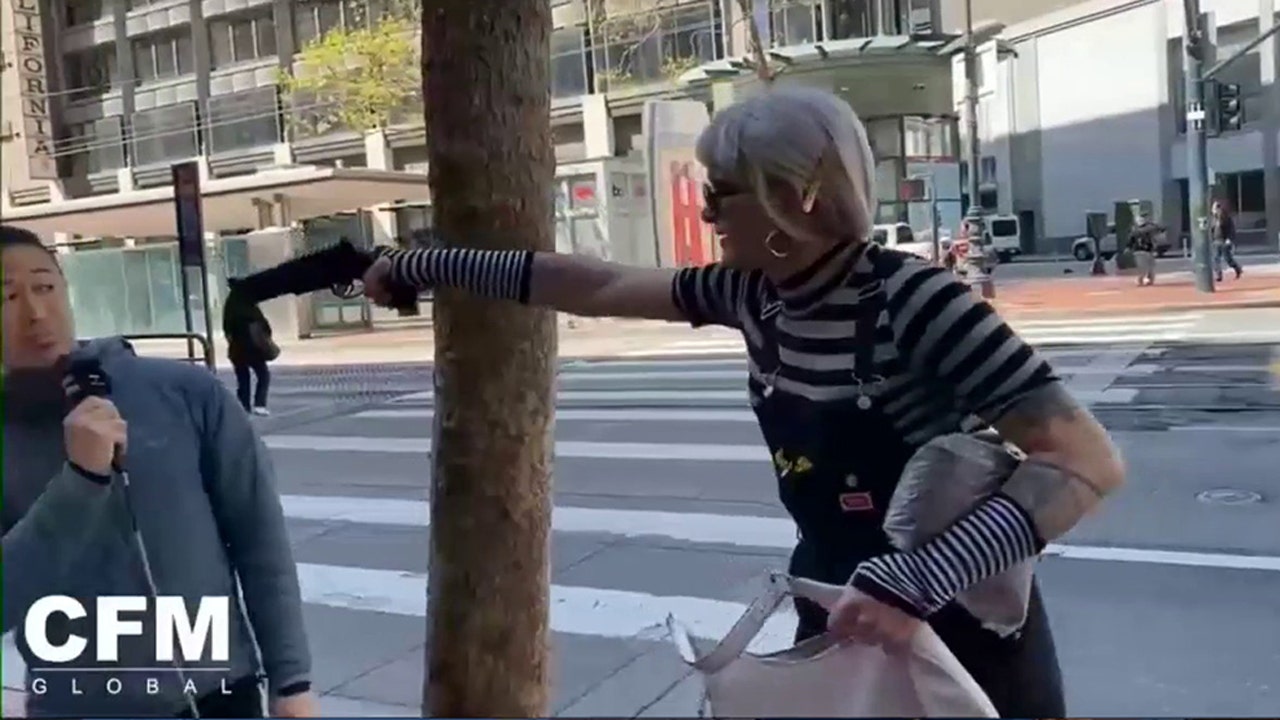 Preacher doesn't flinch as activist points apparent gun at his head